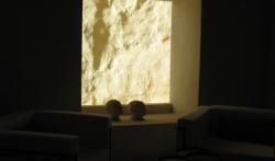 A dark room with a bright window