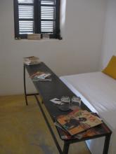 A table at the foot of a bed