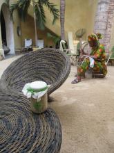 Some wicker mats with a jar