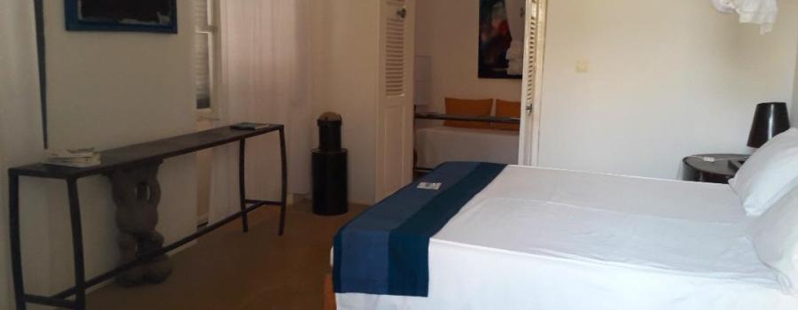 A side view of the Aminou room, pointing toward to door.